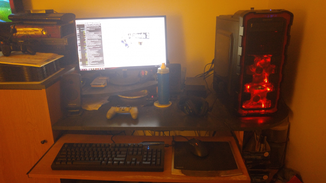 Here's what my desk looks like. There's a Dualshock 4, a Das Keyboard Ultimate S (with unlabeled keys!), and an old Logitech G5 mouse I should replace soon.